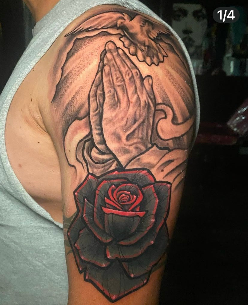 praying hands tattoo with rosary