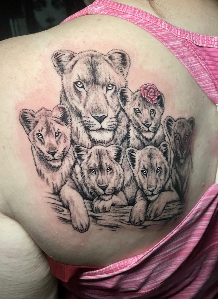 Micro-realistic lioness portrait tattoo on the inner