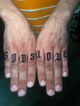 Gothic finger tattoos