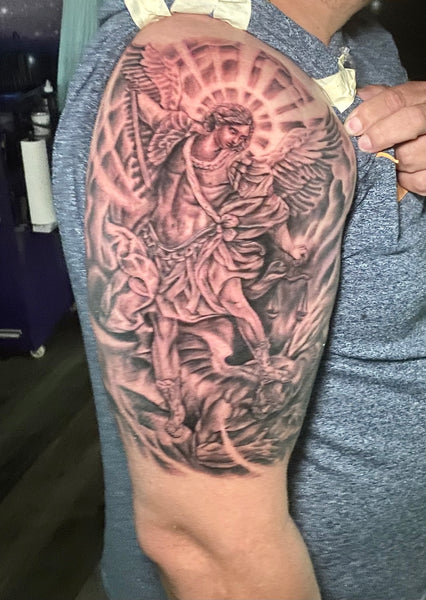 Micro-realistic Archangel Michael tattoo on the upper