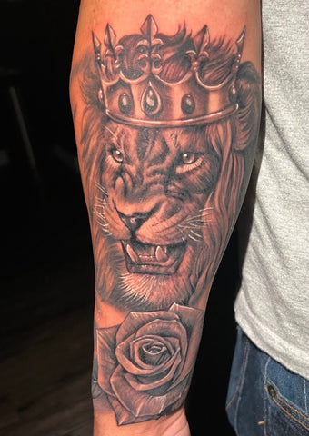 Lion rose tattoo