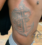 Anchor rose rib tattoo