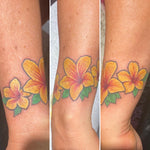 Yellow floral tattoo