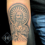 Saint Judas Tadeo Tattoo On The Forearm In Black And Gray Tatuaje Religioso De San Judas Tadeo En El Antebrazo Con Tinta Negra Y Gris