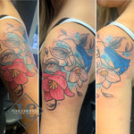 Chilean Bellflower Tattoo On The Shoulder With Many Colors And Blue Accent Splashes