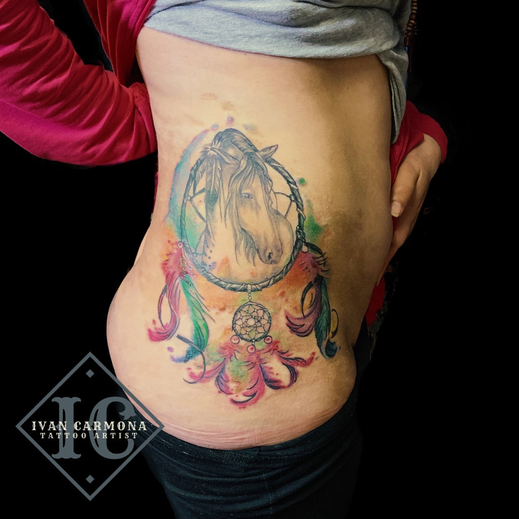 feather tattoos on hip