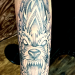 Tribal Wolf Mandala Tattoo In Dot Work Style With Black And Gray Ink On The Hand And Forearm