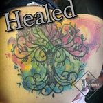 Tree Cover Up Tattoo On The Shoulder With little birds and Watercolors Purple Pink Yellow Green And Blue